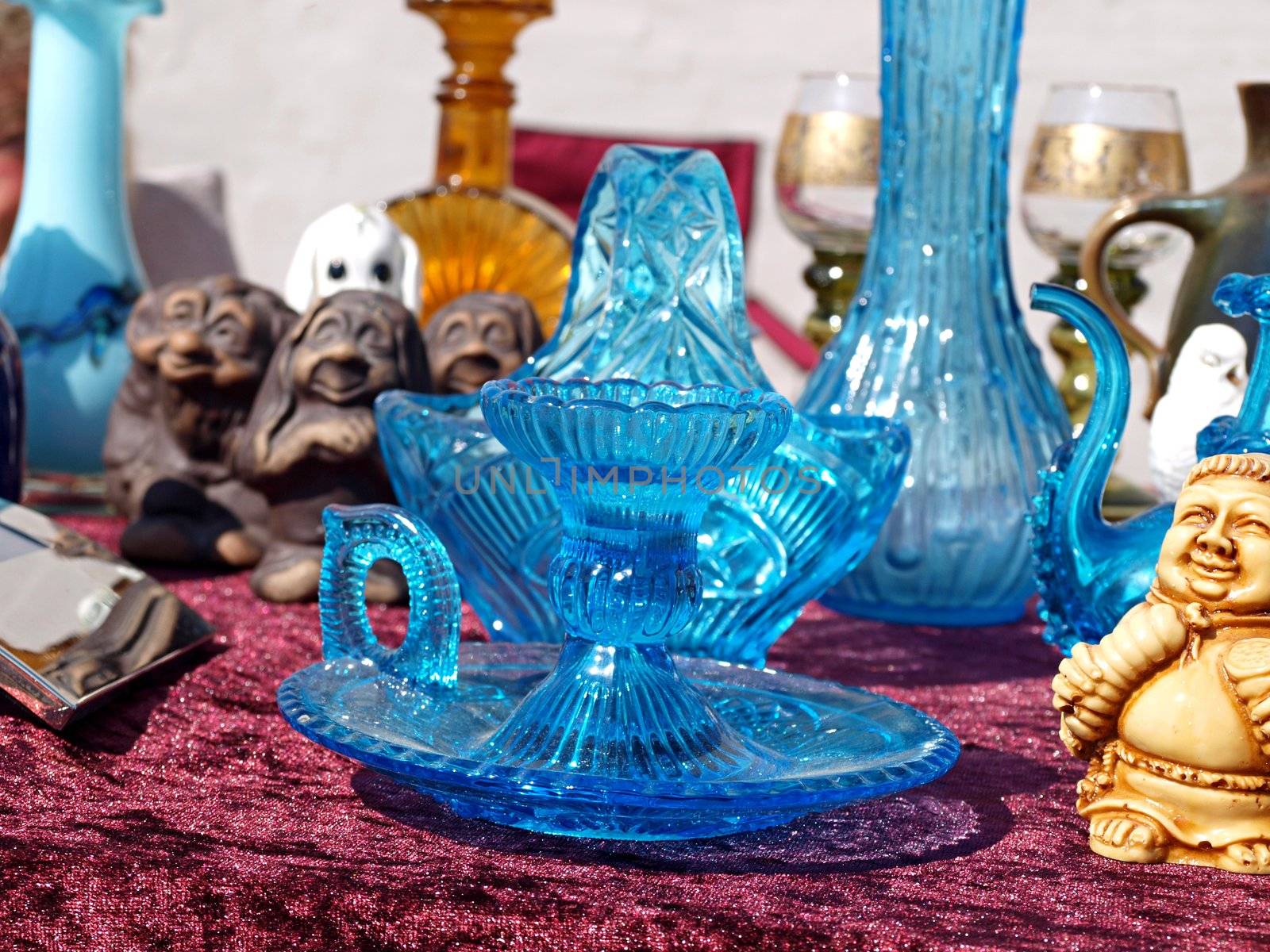 Blue glass items in a flea market stand in Denmark