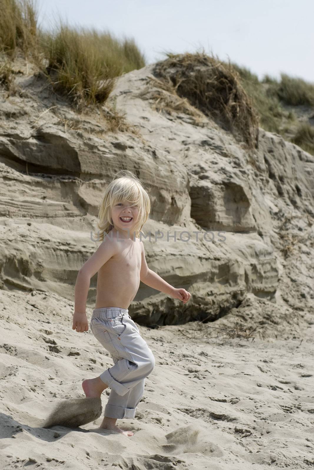 a young boy having fun on the beach