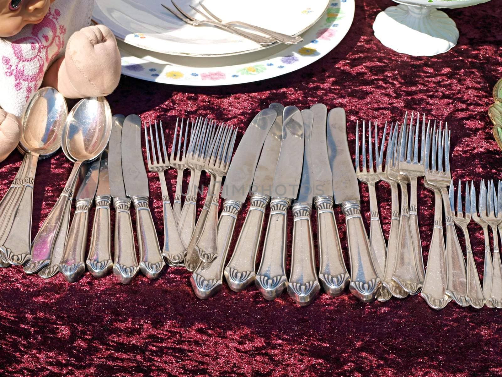 Antique silverware cutlery on display in a flea market      