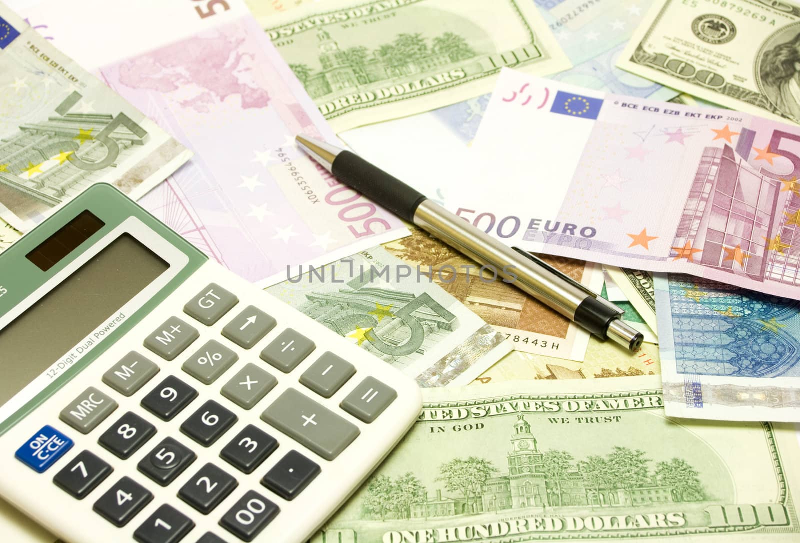 Dollar, euro, lat banknotes, calculator and pen