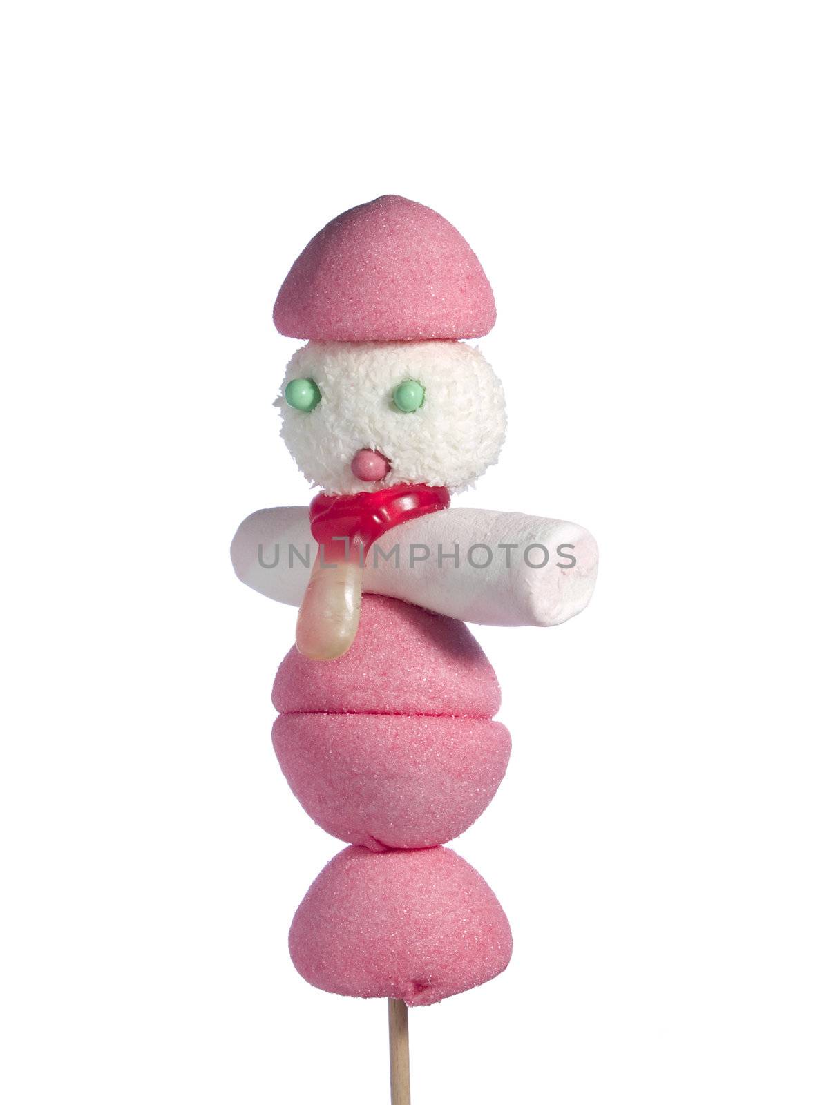 A male figurine made out of candies on a stick over a white background.