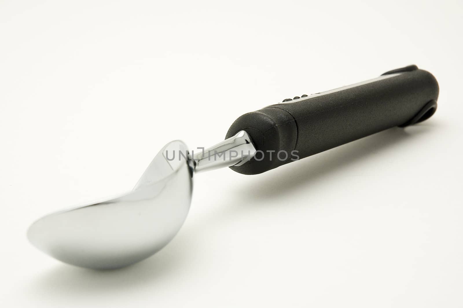 Ice cream spoon on a white background