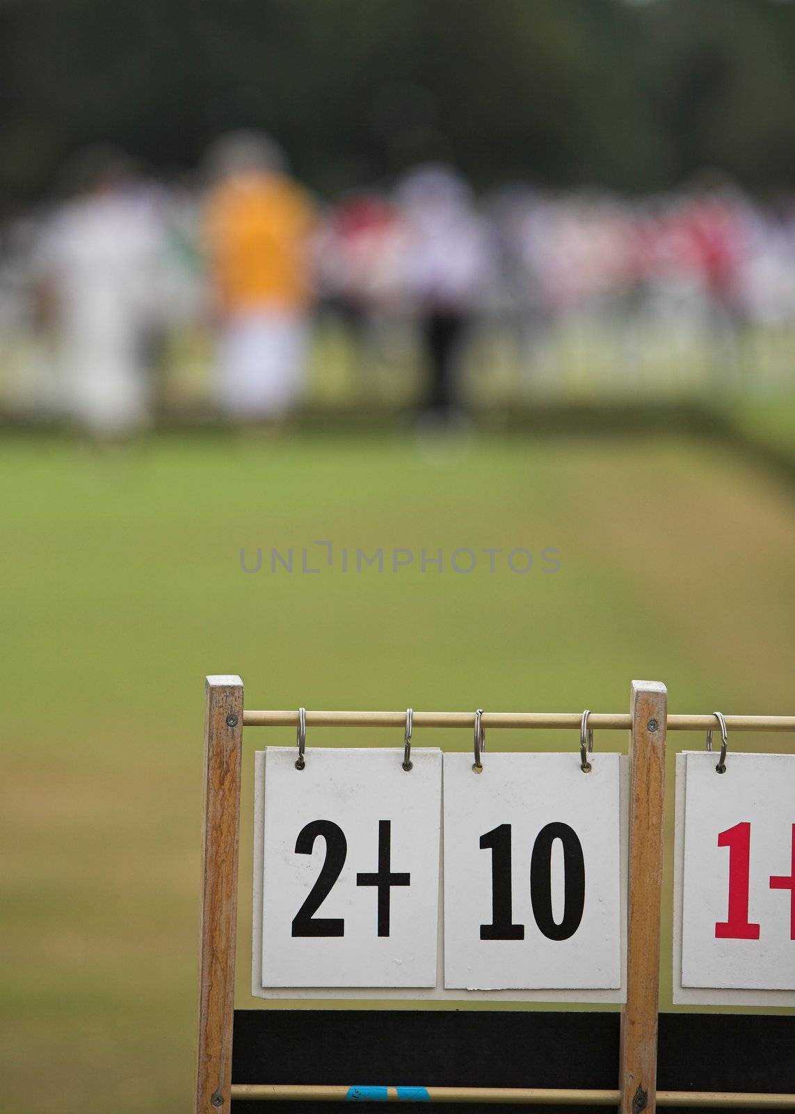 A game of lawn bowls with focus on the scoreboard.