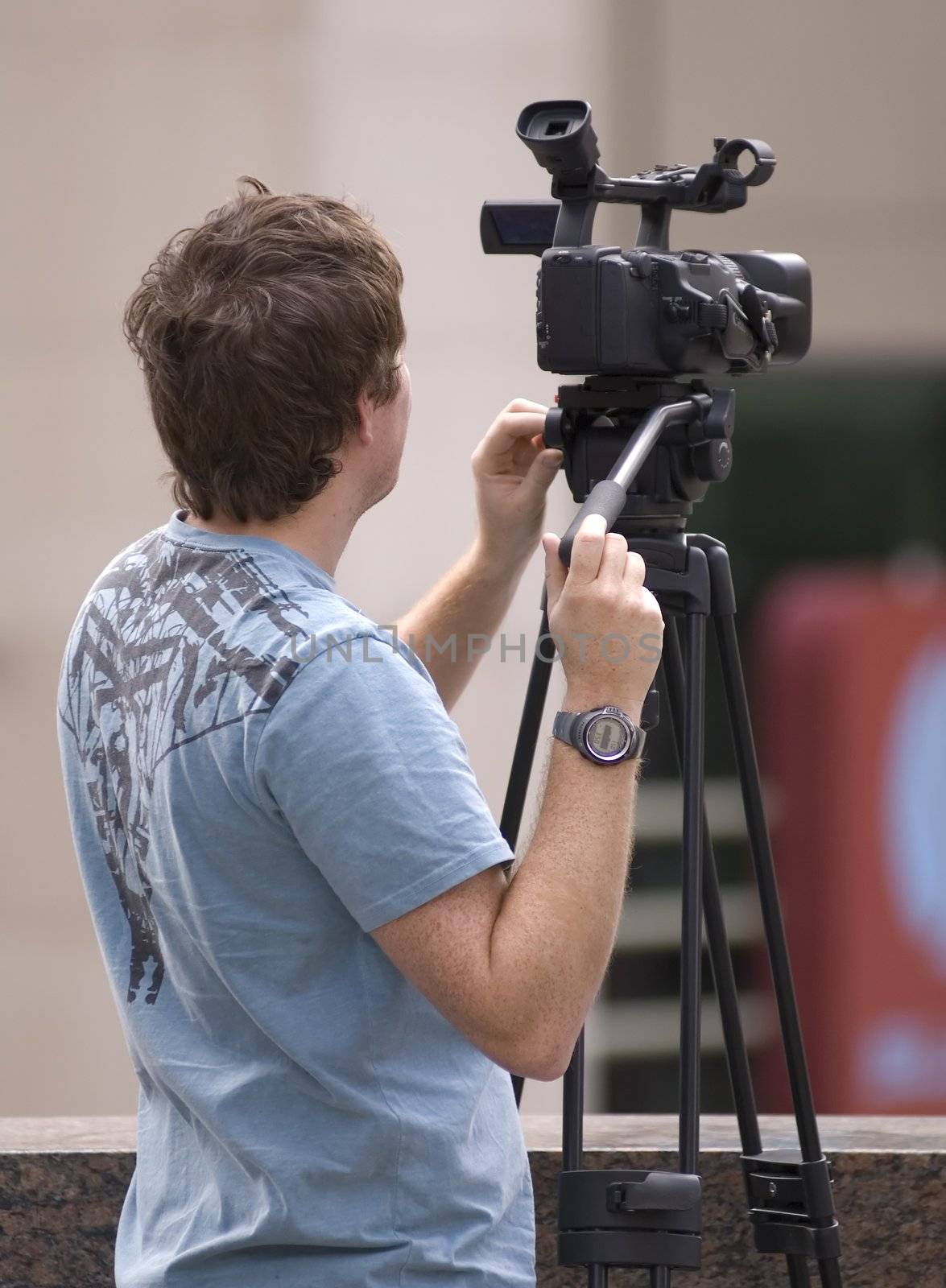 a man working with his video camera