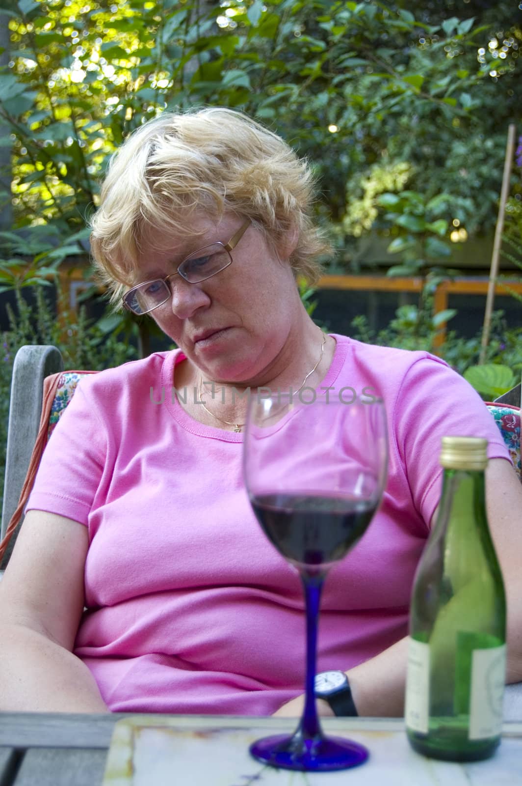 elderly woman falling a sleep after drinking wine