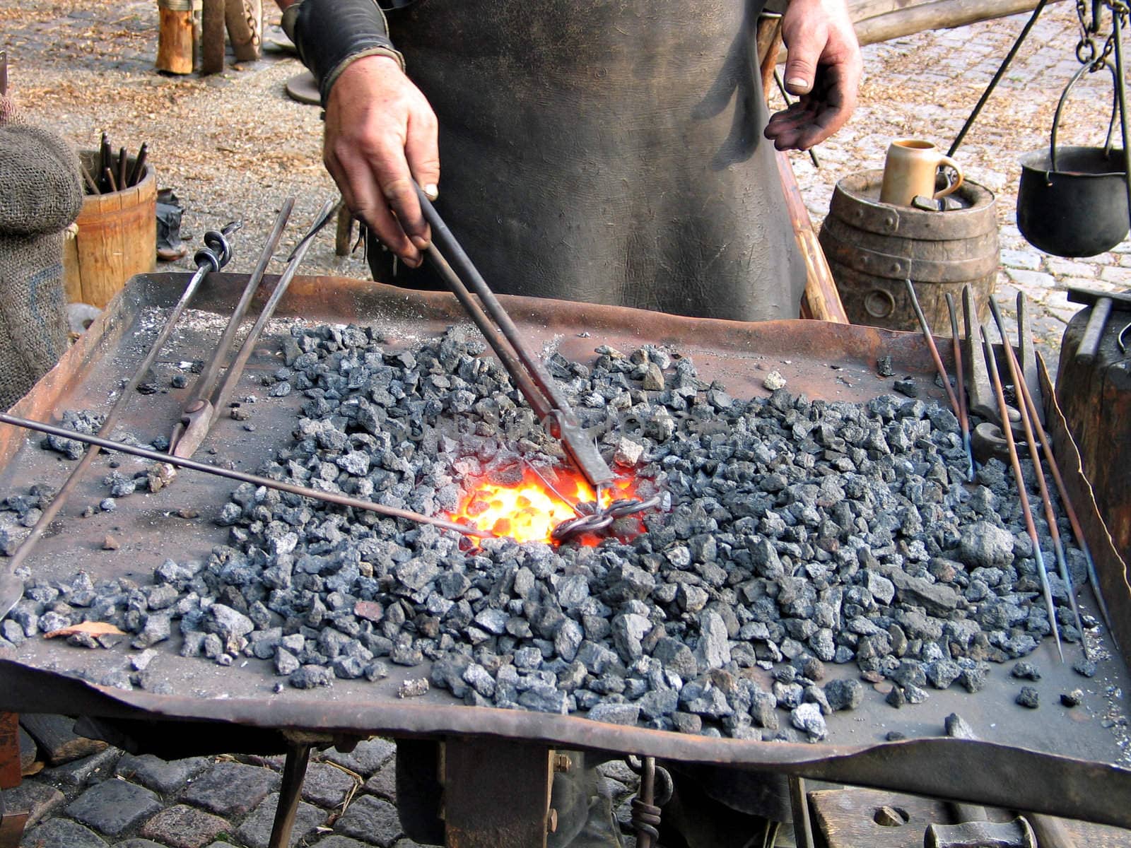 Blacksmith at work in Medieval tradition