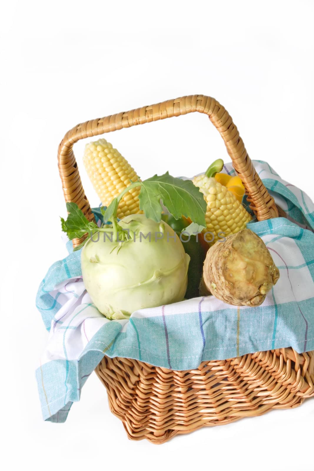 Fresh vegetable in a basket on bright background