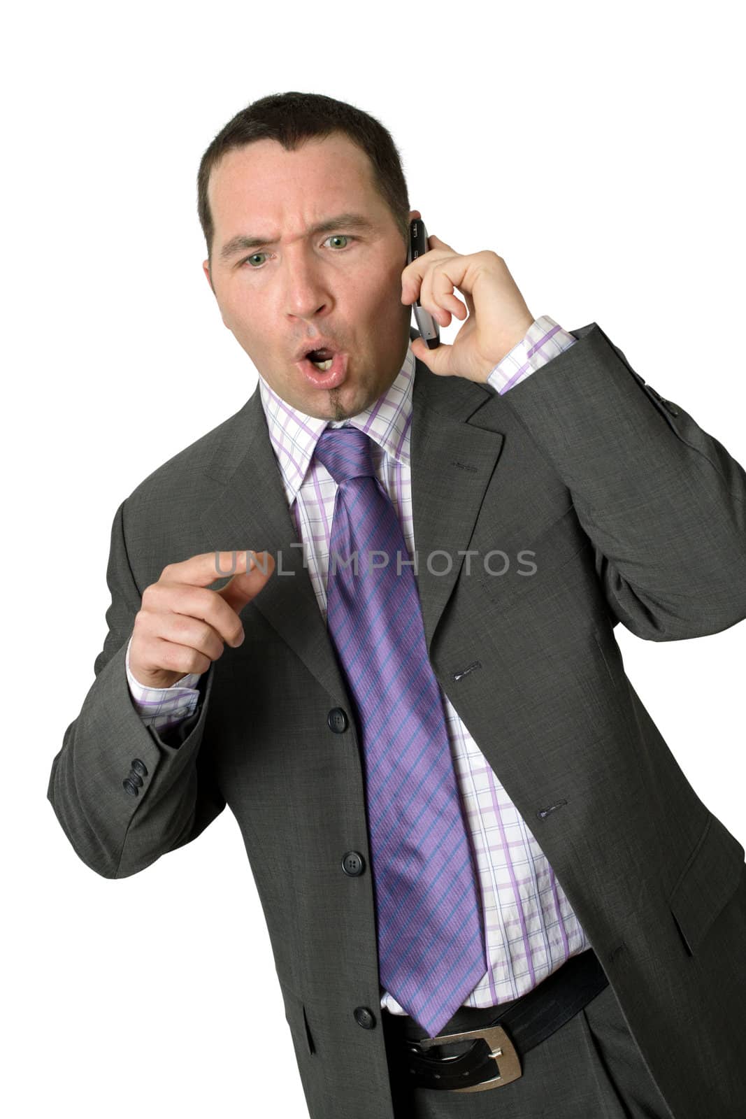 Upset businessman on his cellphone.
