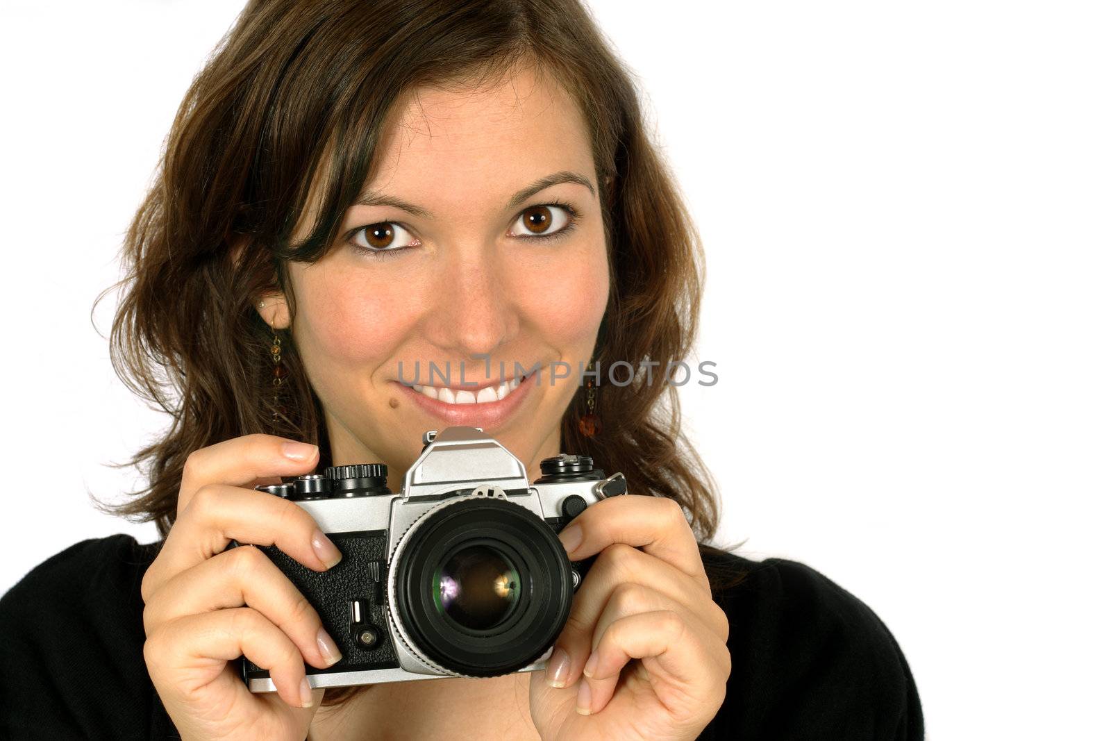 Beautiful female photographer / tourist pointing a camera.
