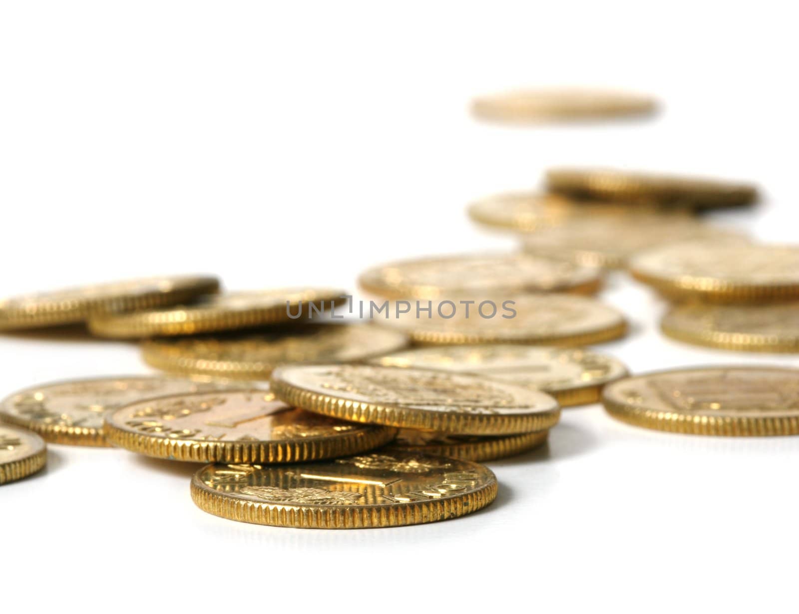 Cold coins scattered. Shallow depth off field - focus on frontmost coin