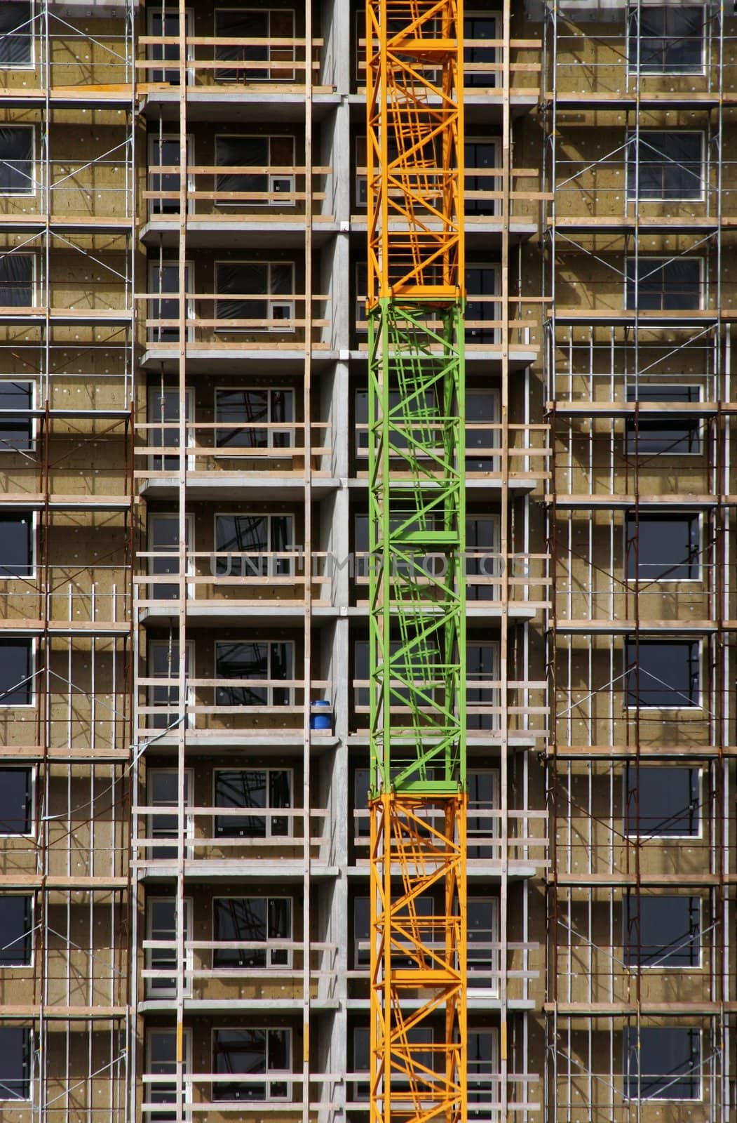 Large building under construction with scaffold