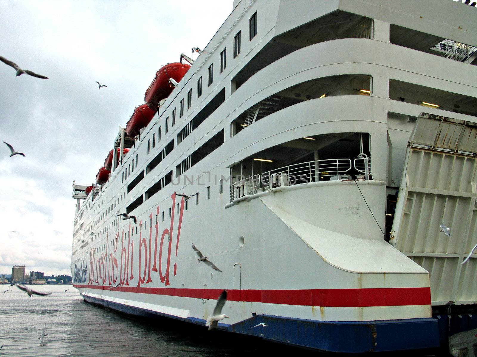 Ferry boat by the dock in rear view