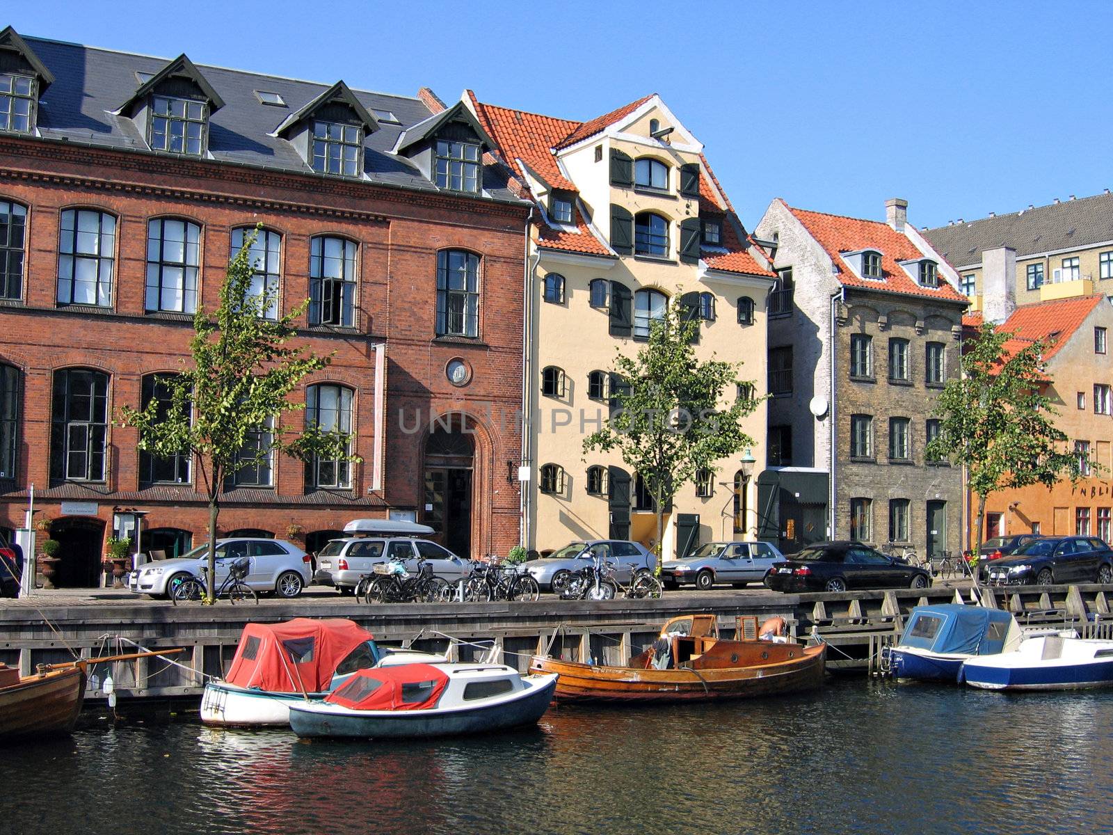 Copenhagen - houses and boats in the water front of the canals