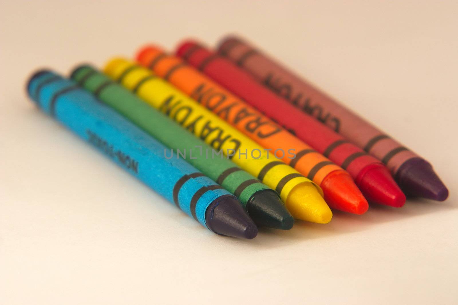 set of six wax crayons in a row