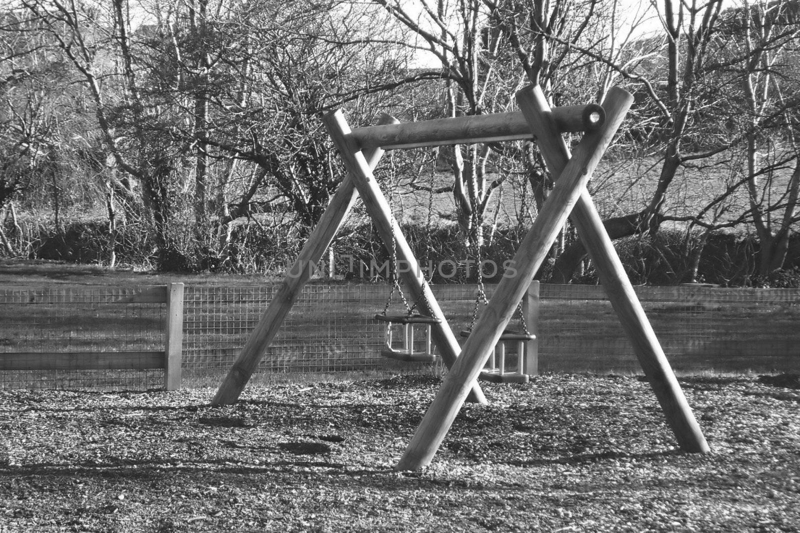 wooden climbing frame on a childrens playground