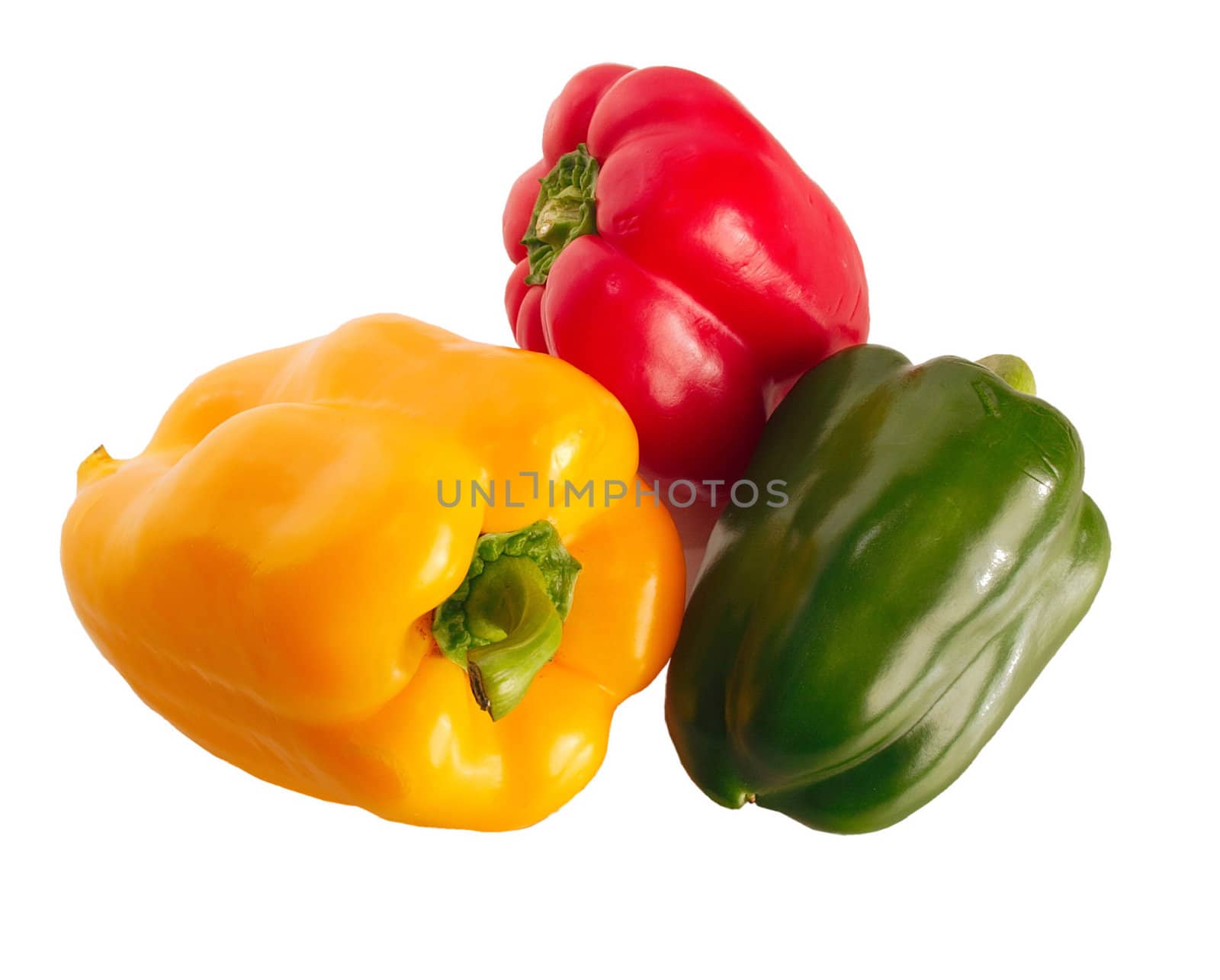 three assorted coloured bell peppers on a shiny surface