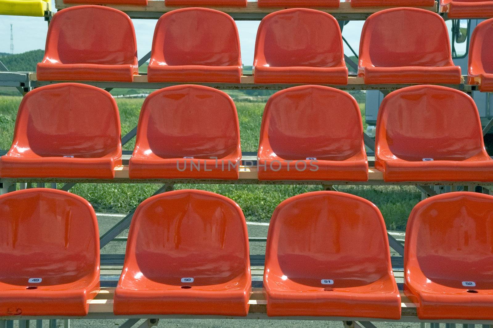 Lines of red seats.