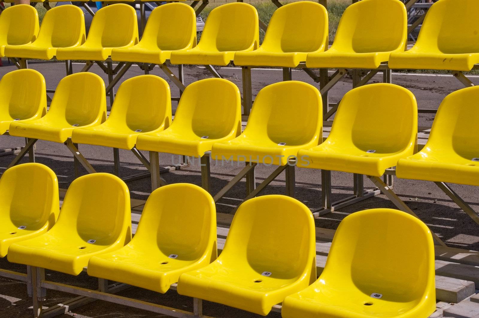 Lines of yellow seats.