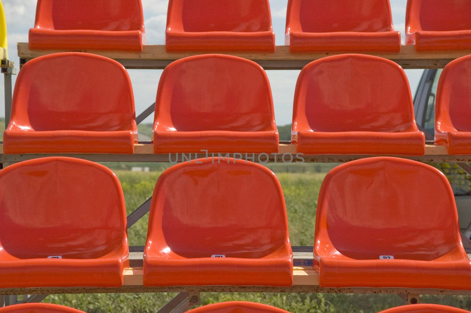 Lines of red seats.