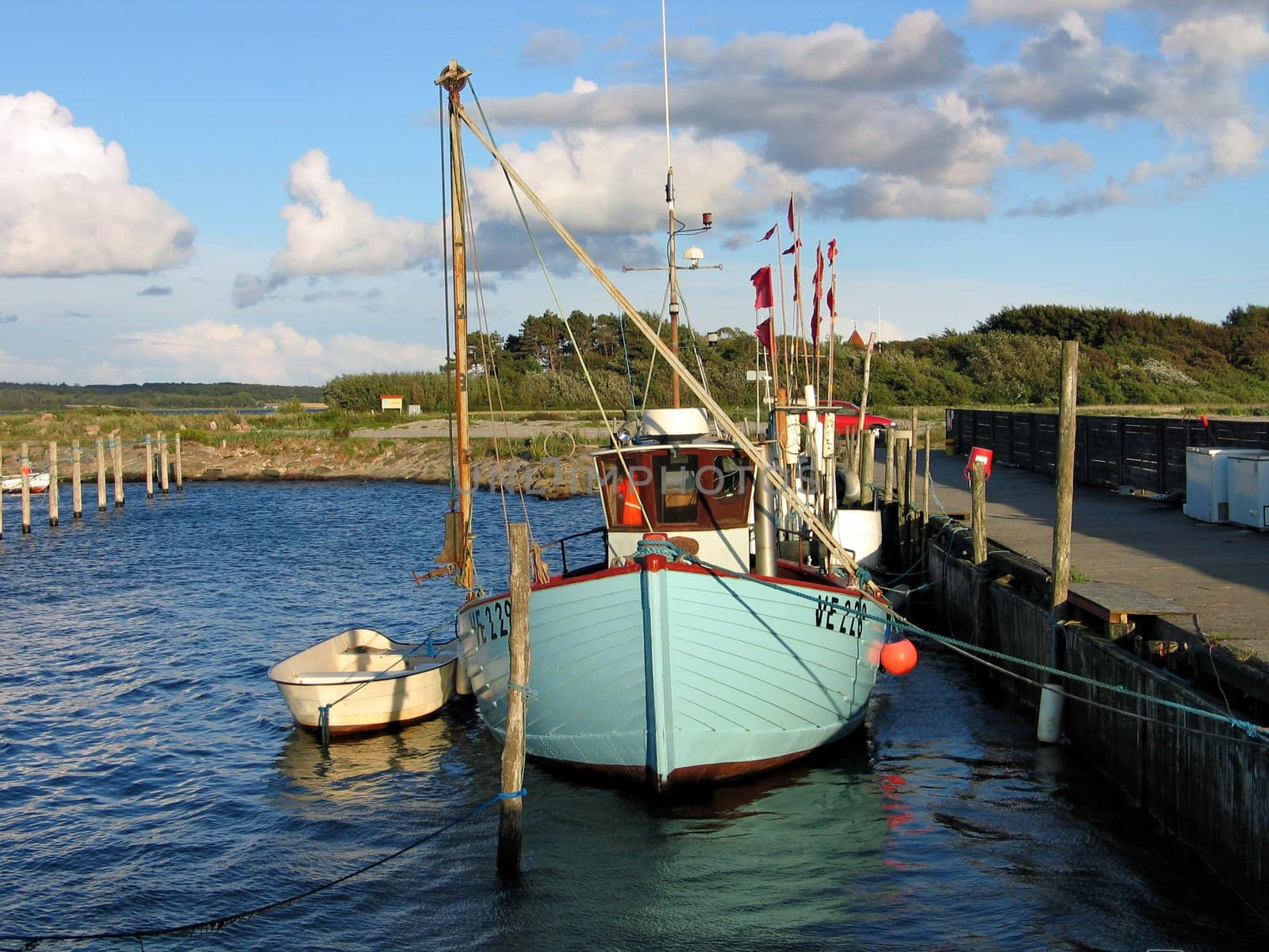Colorful traditional fishing boat in a small port Funen Denmark