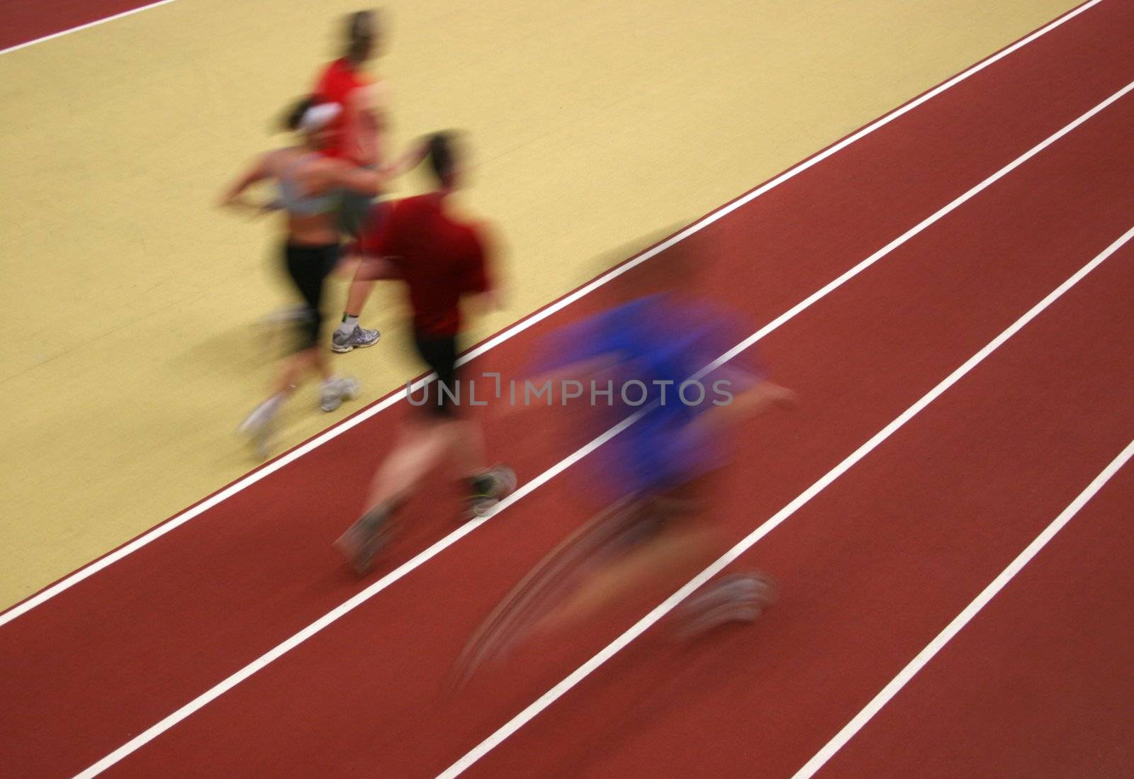 Motion blurred athletes competing on the track