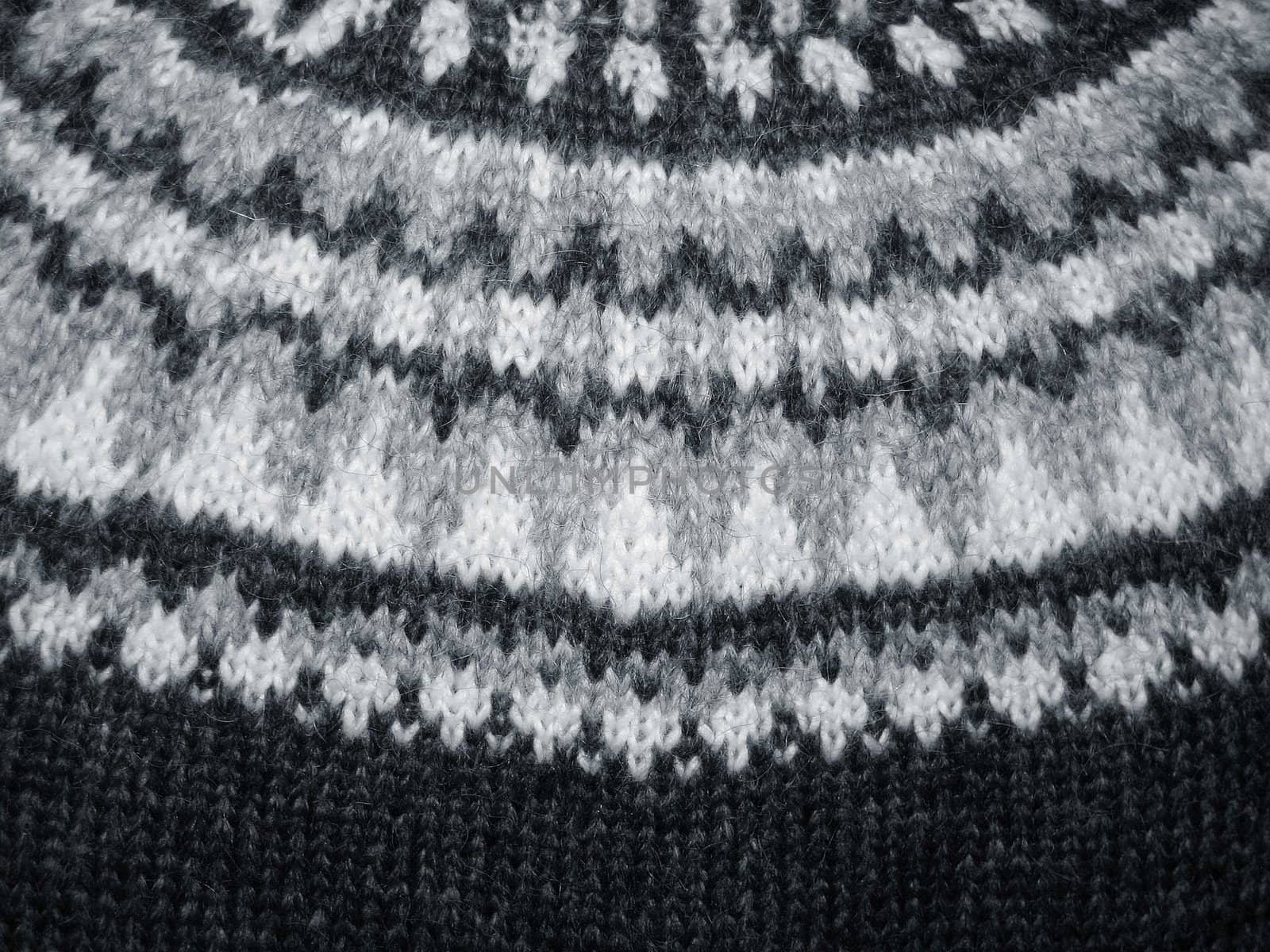 Macro of a handmade wool sweater with old pattern