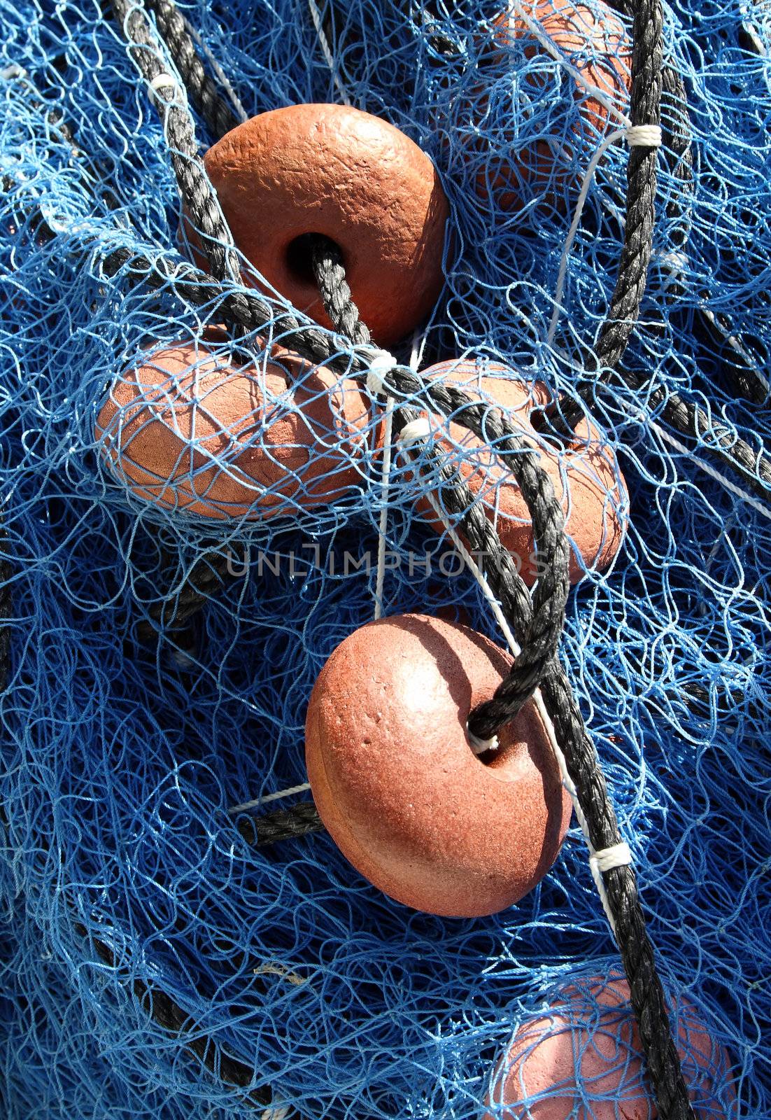Close up view of a blue fishing net.