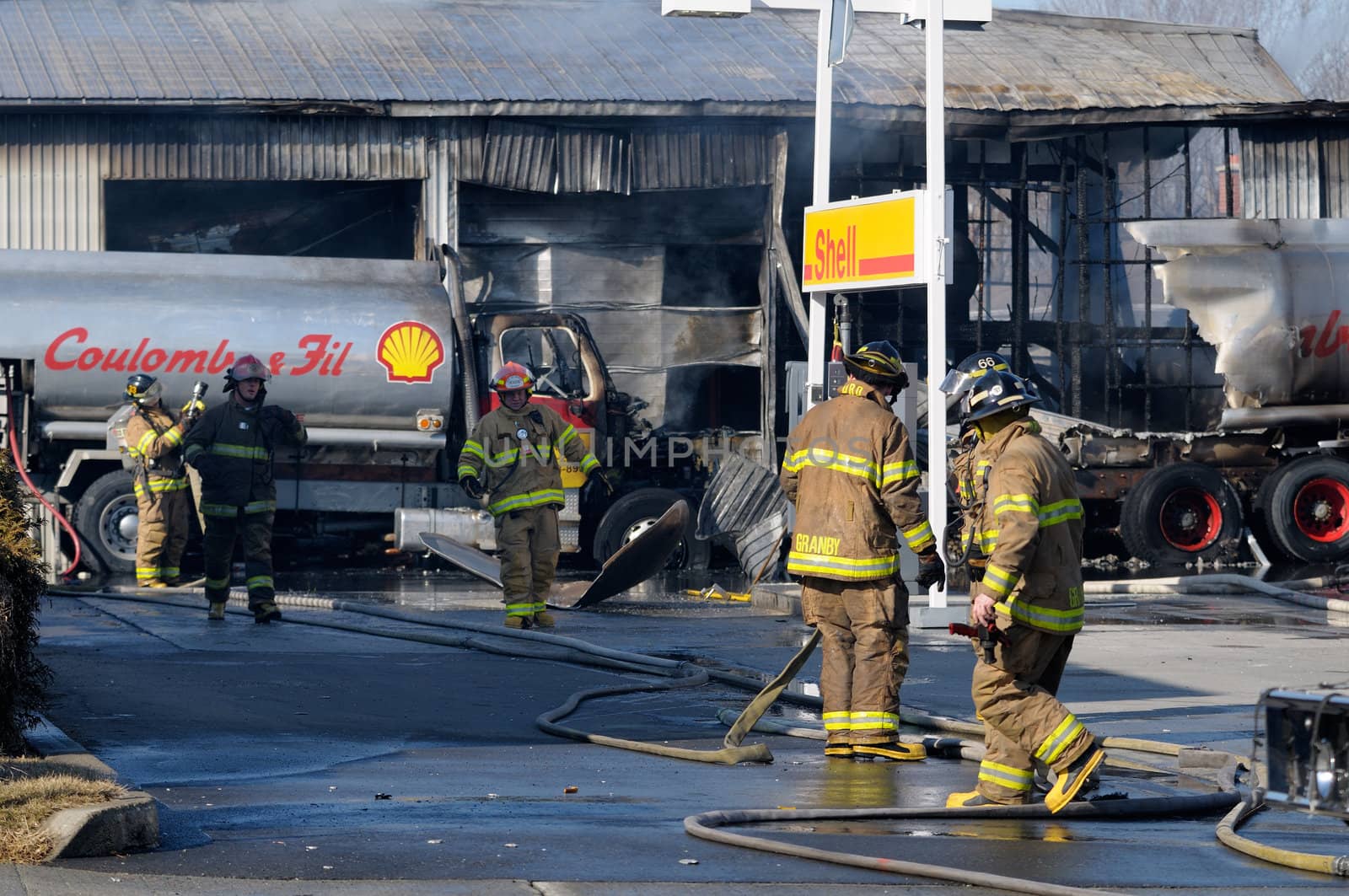 Firemen fighting a fire involving tank trucks
at a gas station Granby, Quebec, Canada on March 10th, 2010