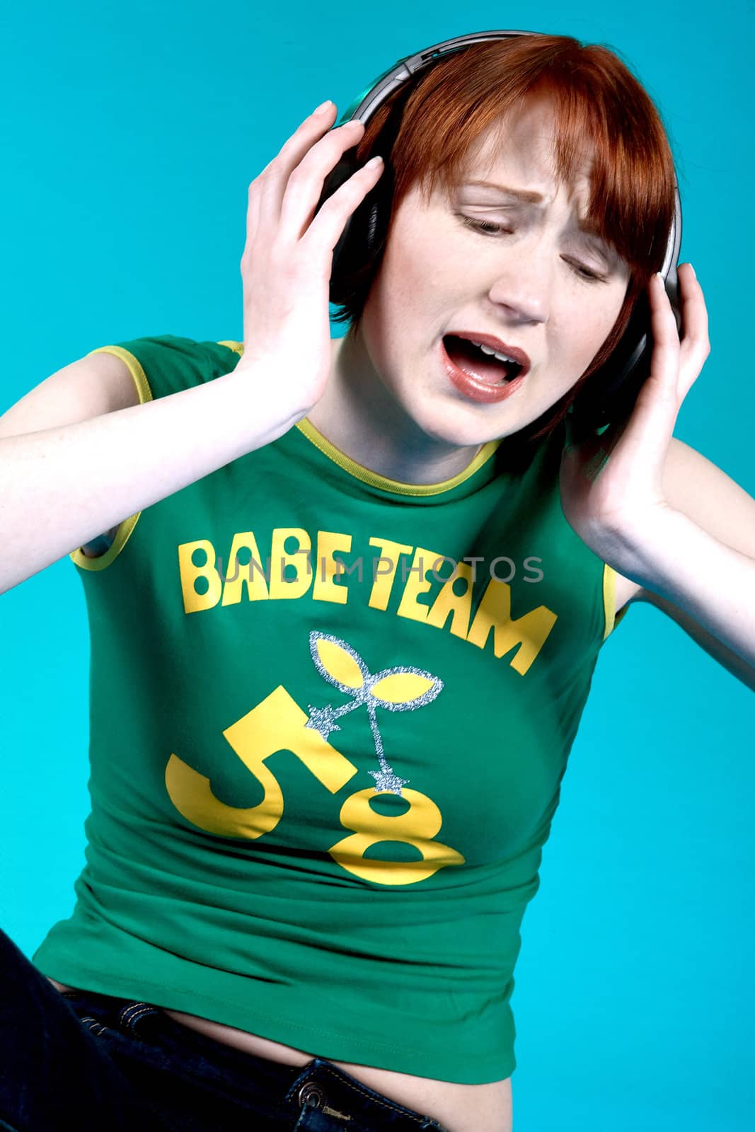 Red haired girl listening to her favourite music