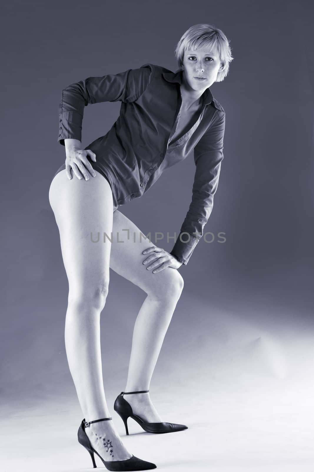 Short haired blond with long legs showing her long legs