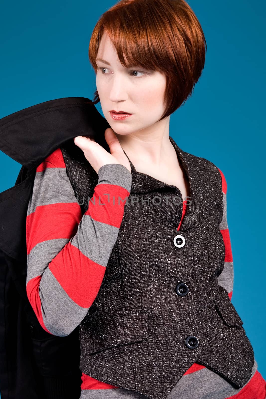 Young red haired girl with a fashion attitude