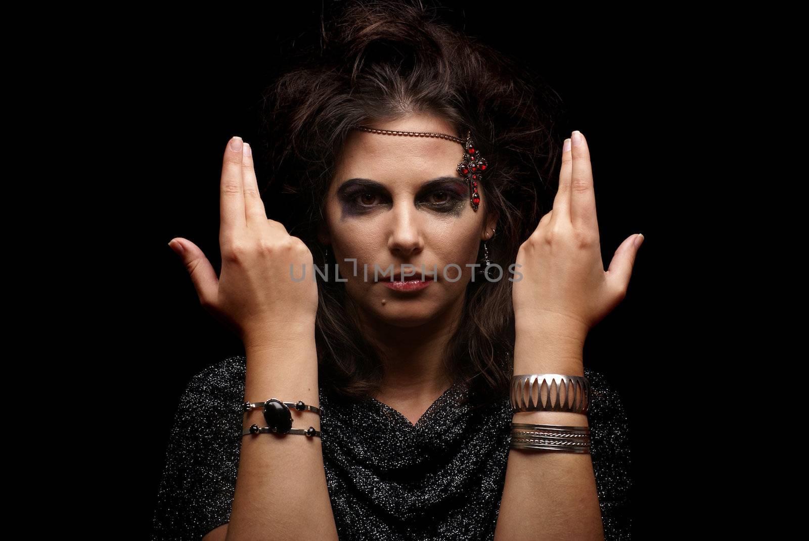 Portrait of witch over dark background              