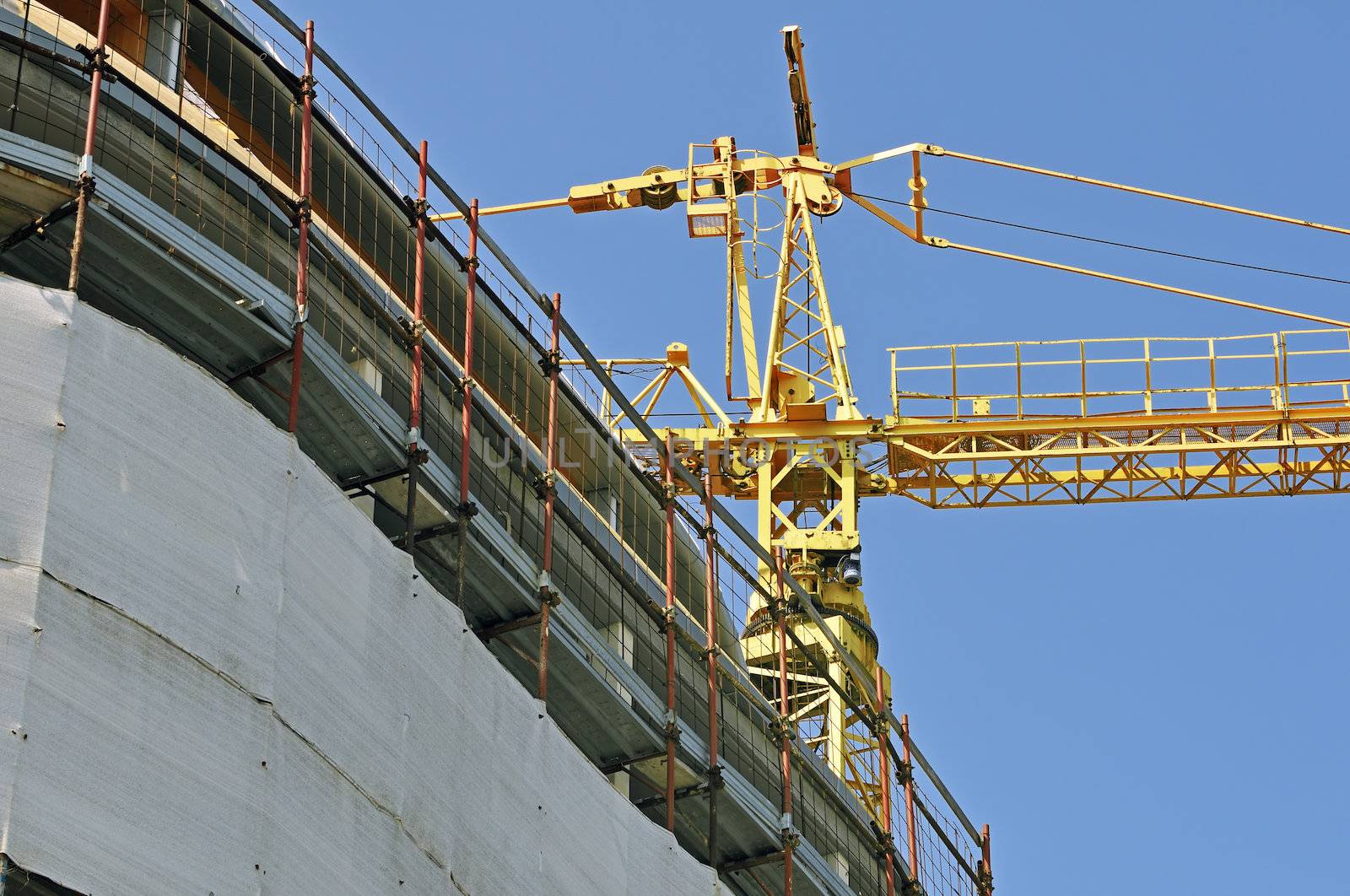 View of a new building with a yellow crane