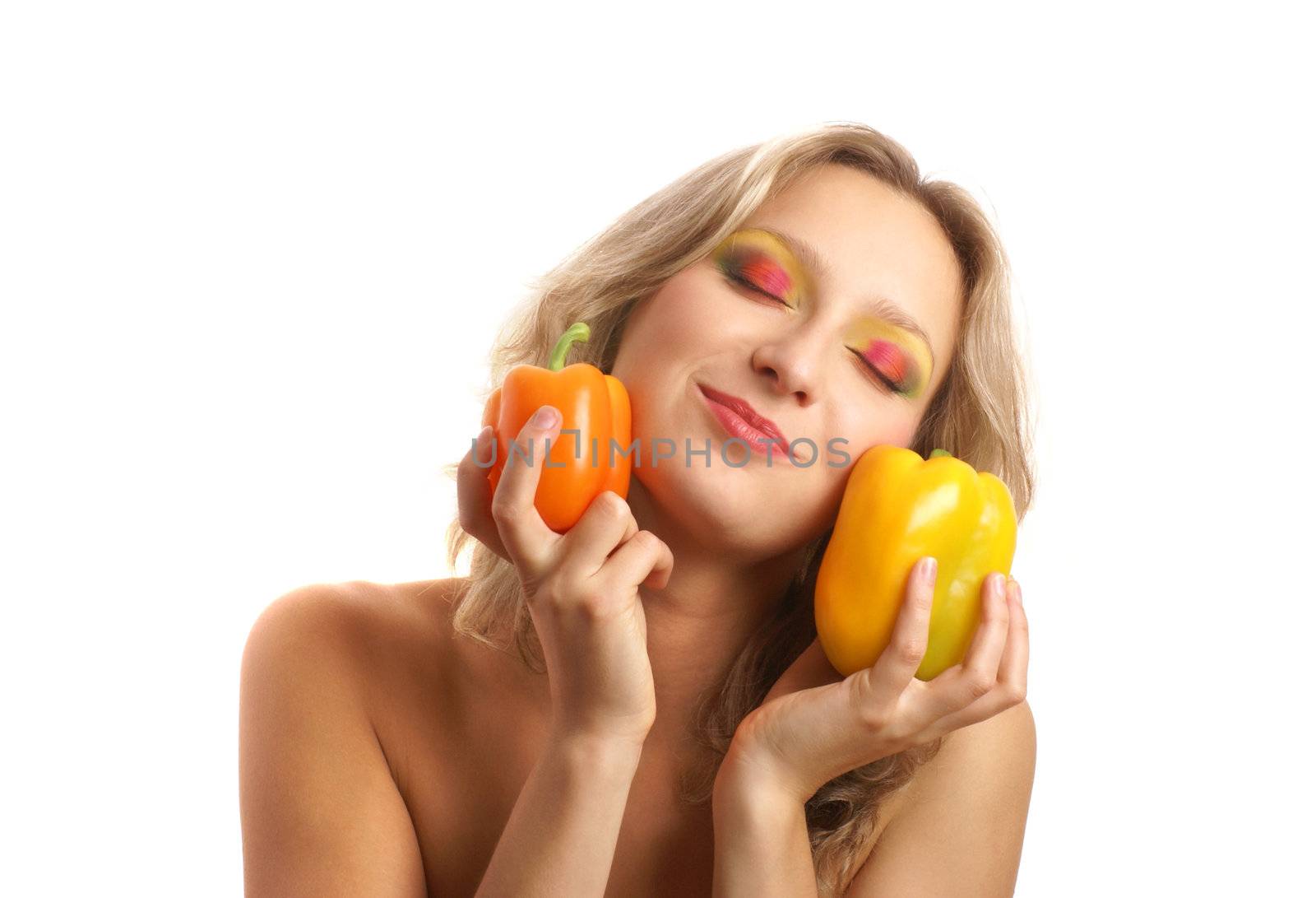 Young beautiful woman with bright peppers isolated on white      
