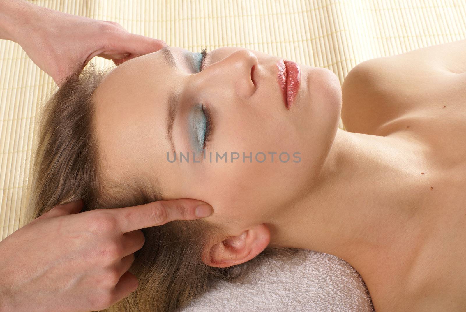 Attractive woman getting spa treatment isolated on white