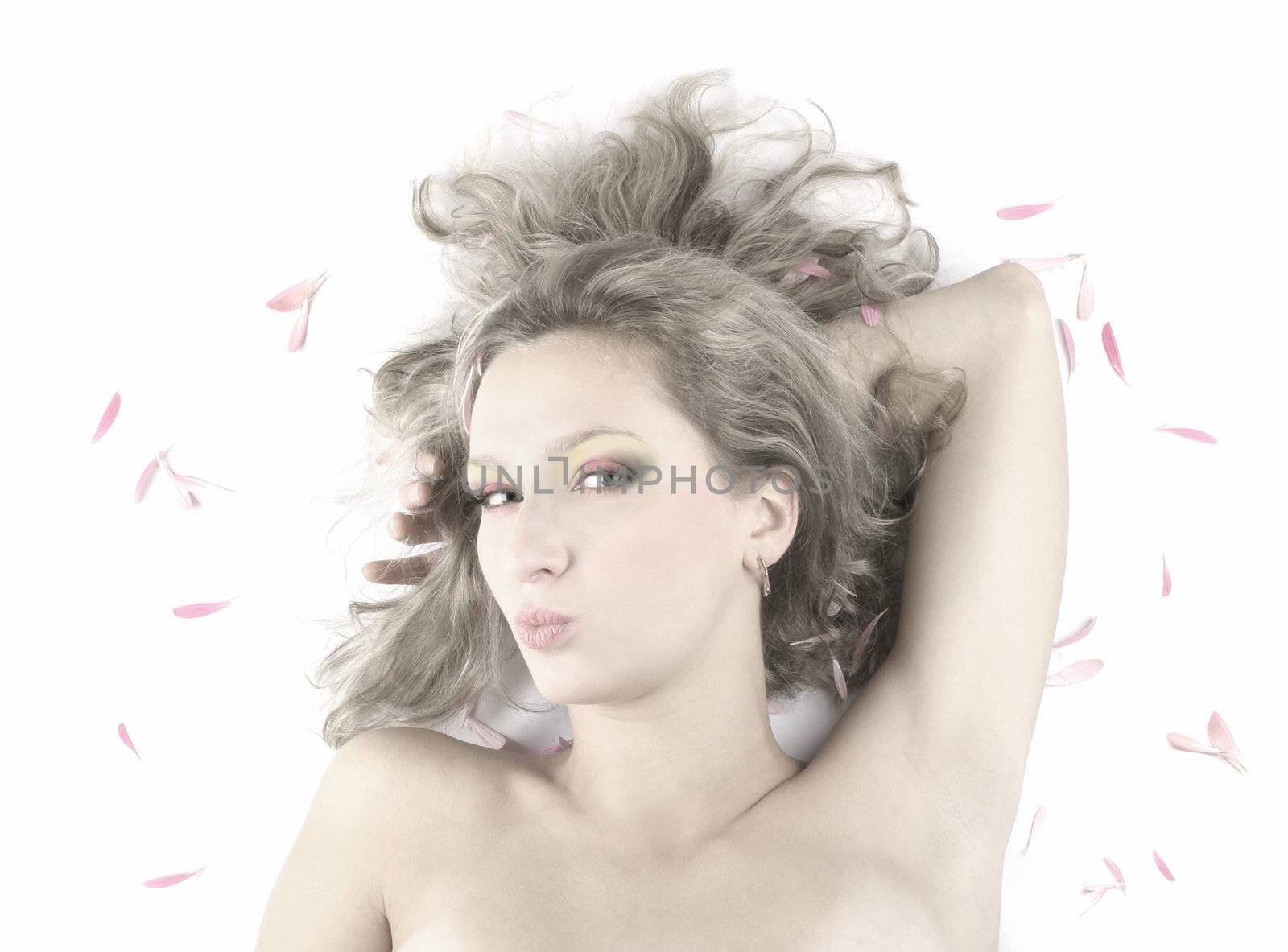 Young beautiful woman dreaming on white      