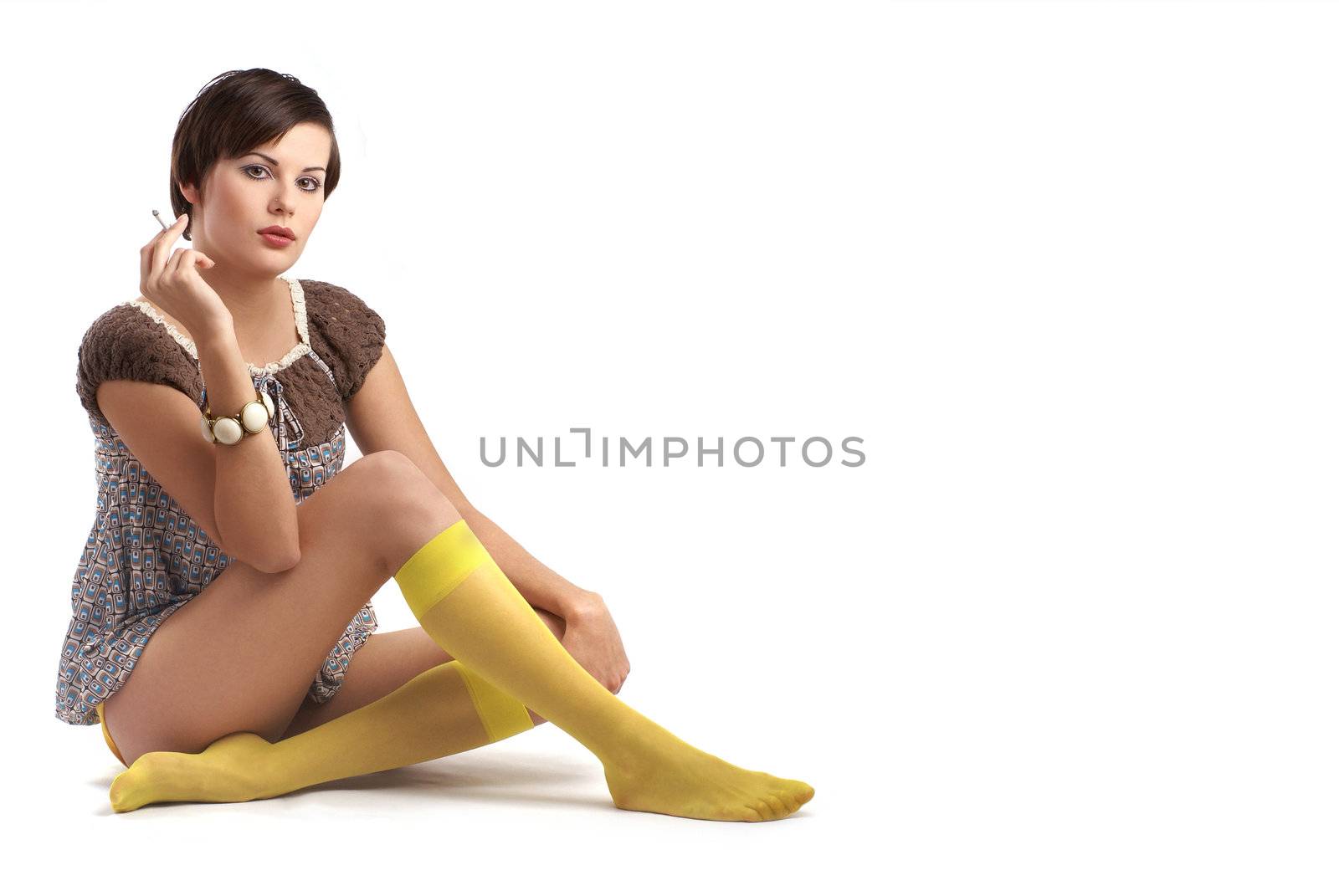 Attractive retro woman wearing bright dress isolated on white         