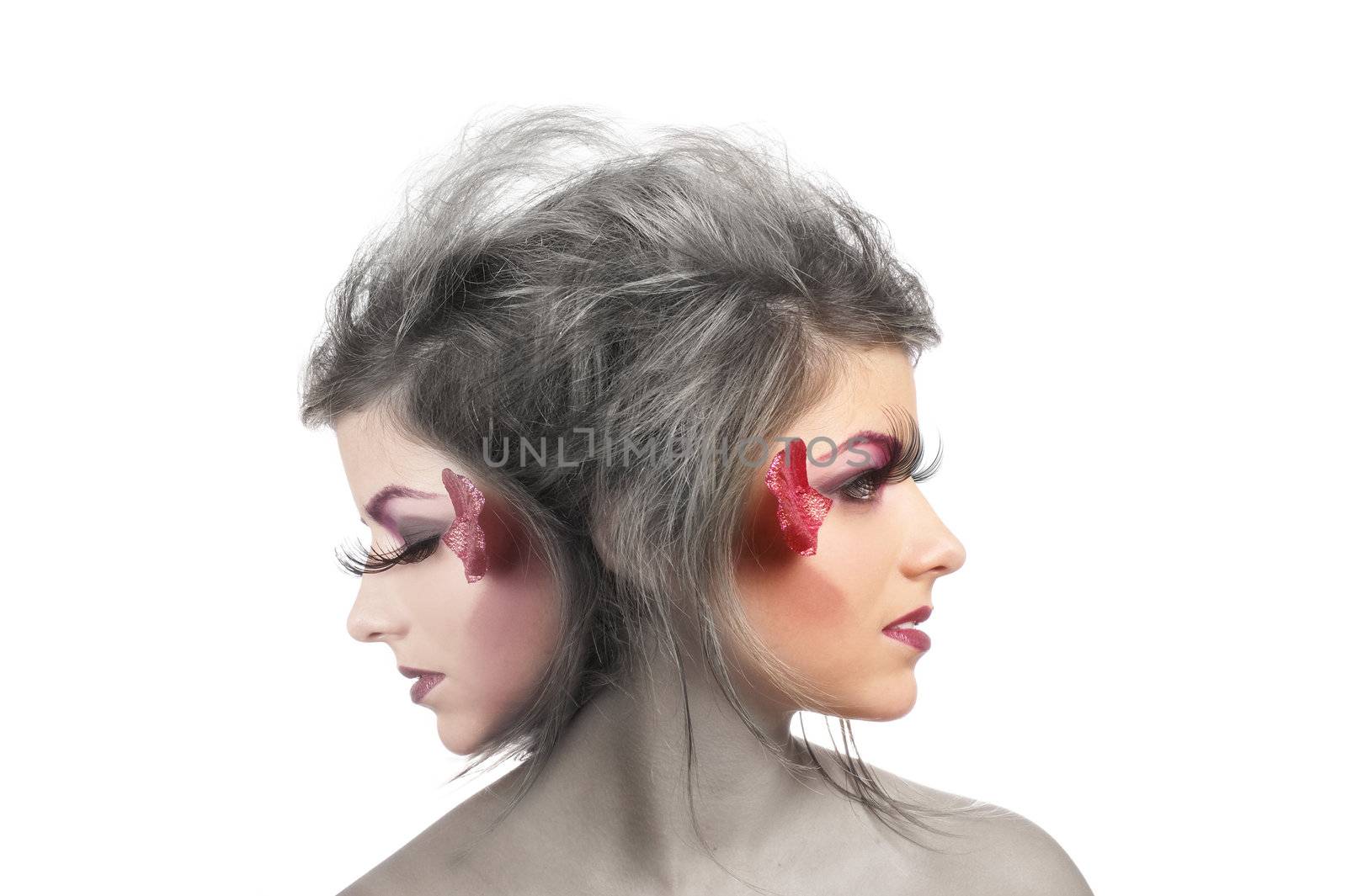Young beautiful fantasy woman with two heads isolated on white      