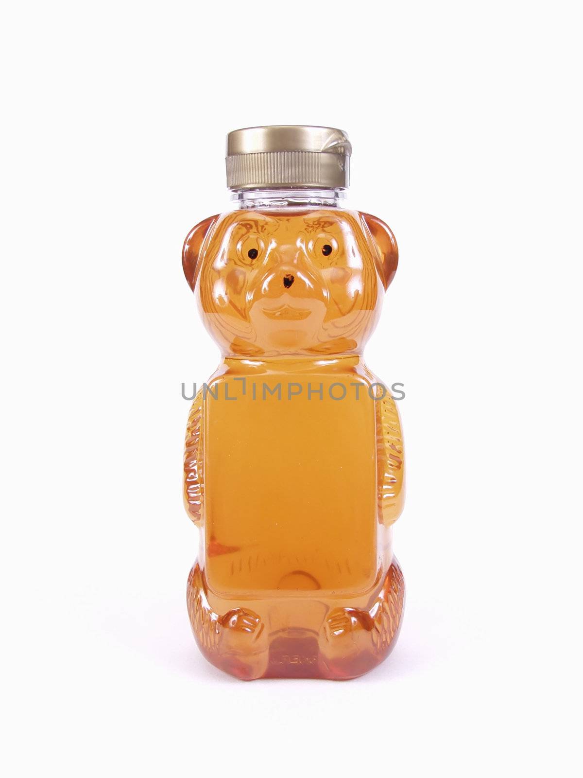 A full Honey Bear Bottle and silver cap isolated on a white background