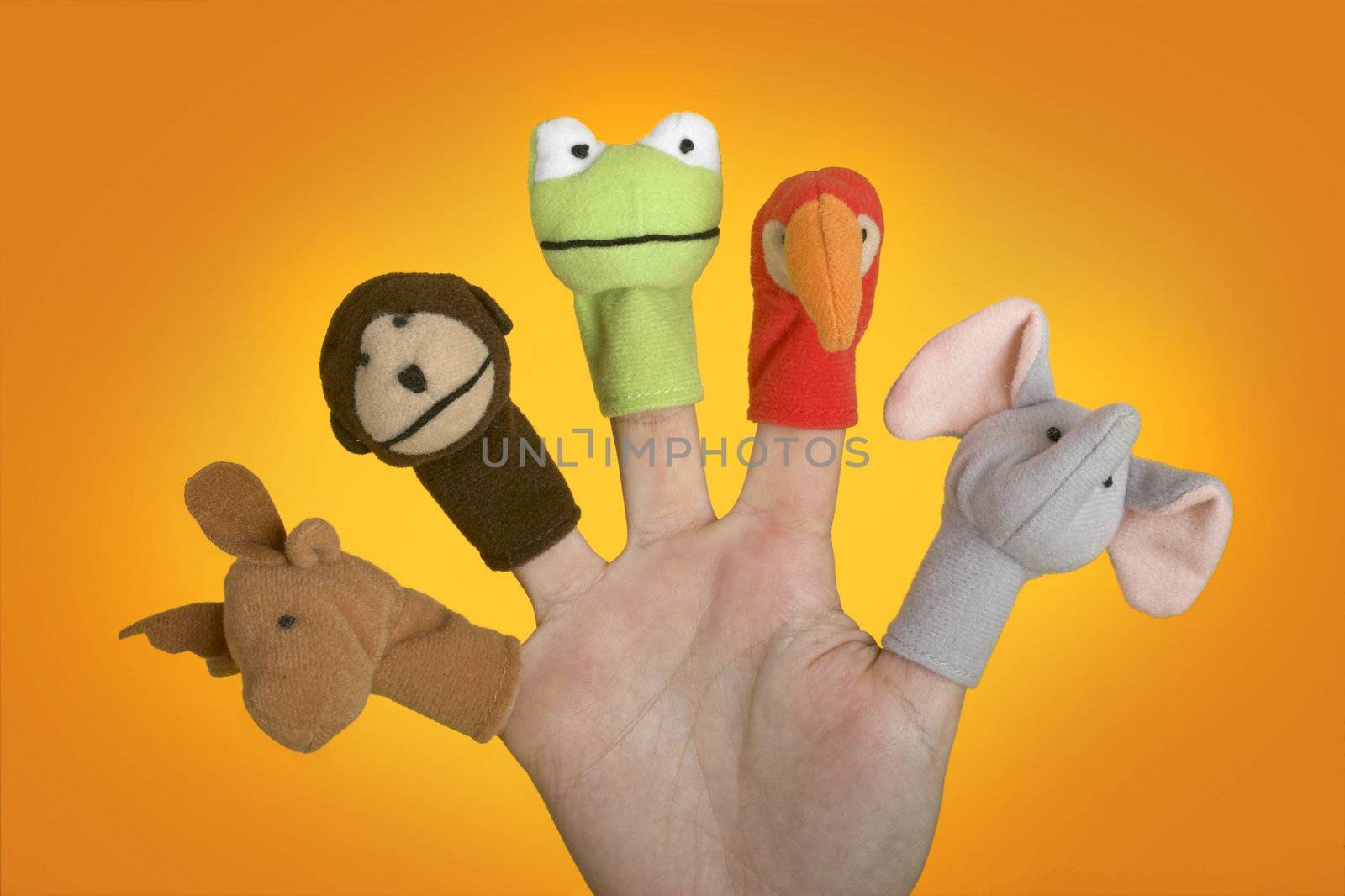 Female hand playing with puppets on the fingers