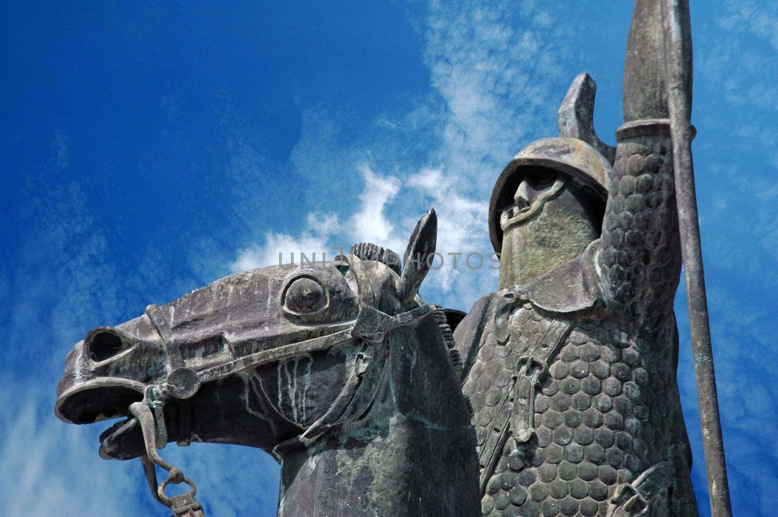 knight and horse statue in blue sky by raalves