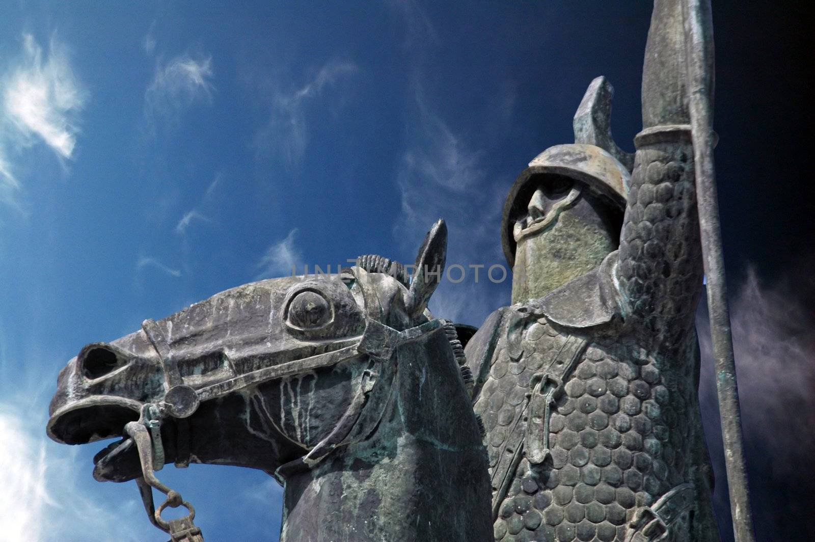 knight and horse statue in blue sky by raalves