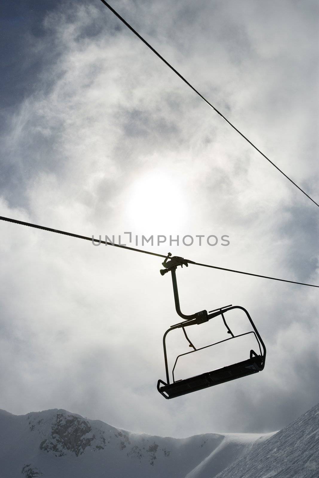 Empty chair lift at ski resort.