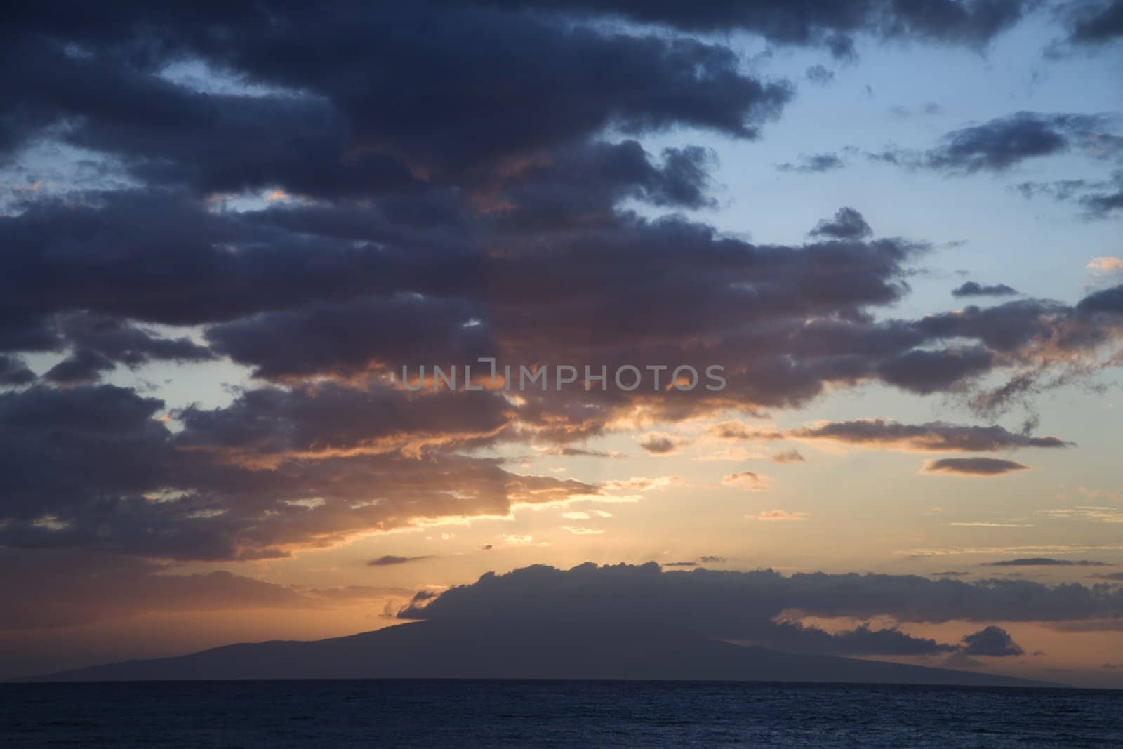 Sunset clouds over the coast of Kihei, Maui, Hawaii, USA.