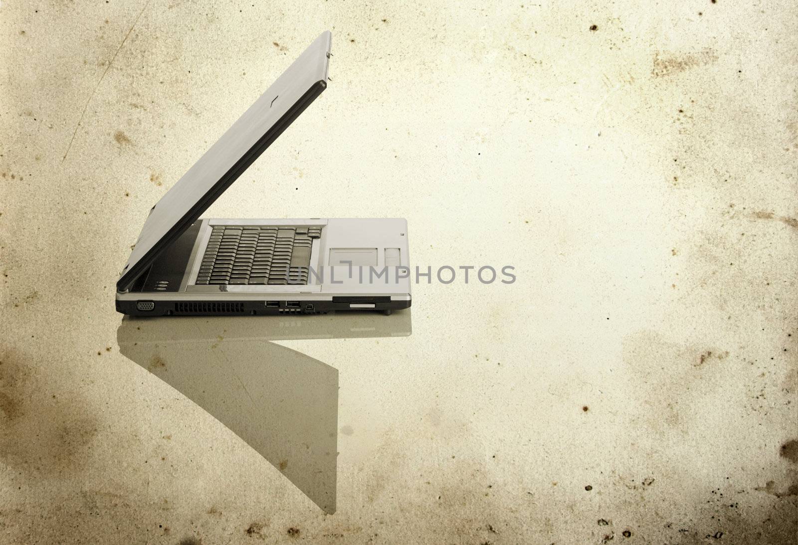 Picture of a laptop on a white background with a grunge background

