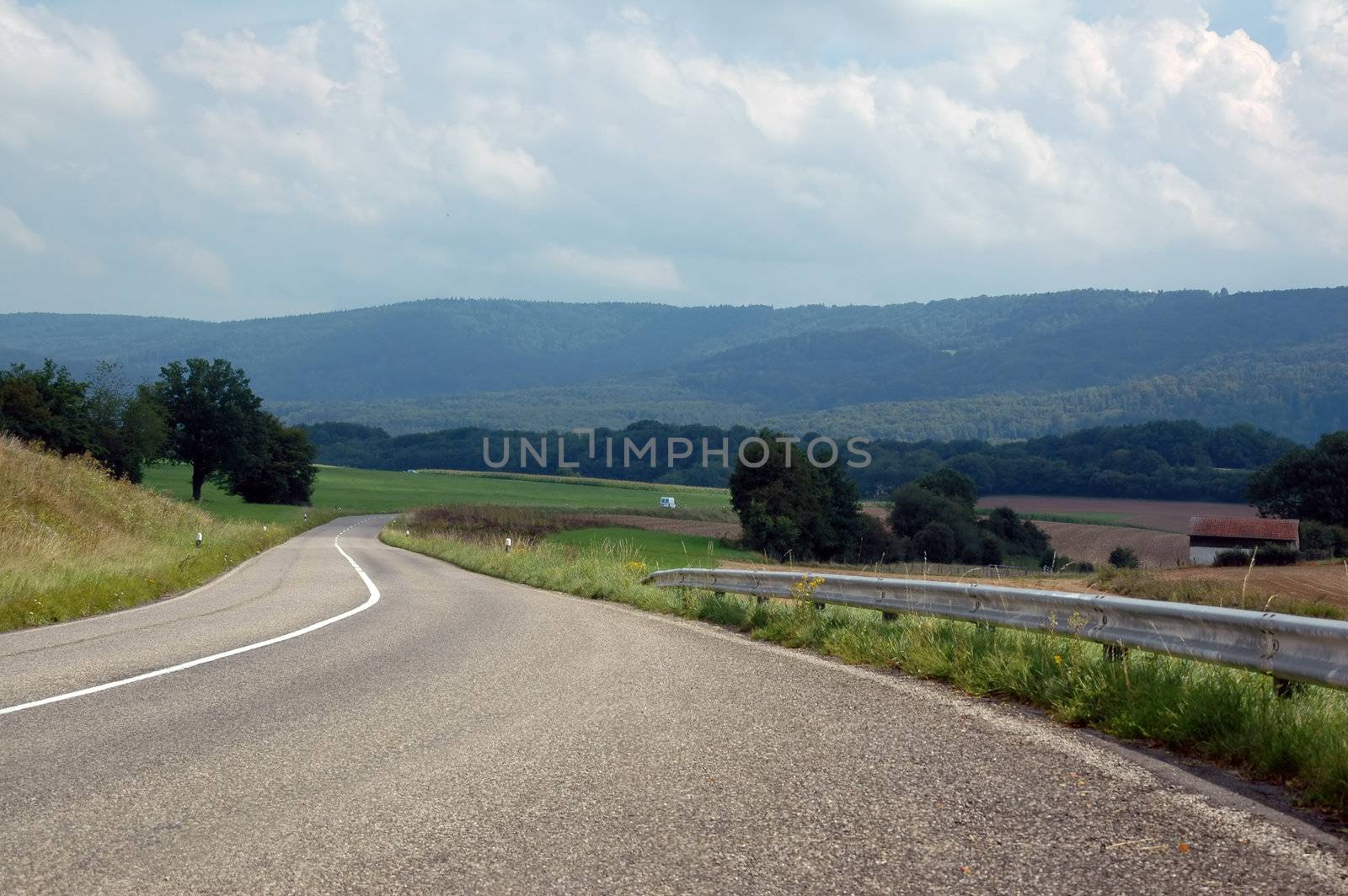 asphalt road in landscapes of porrentruy, switzerland by raalves