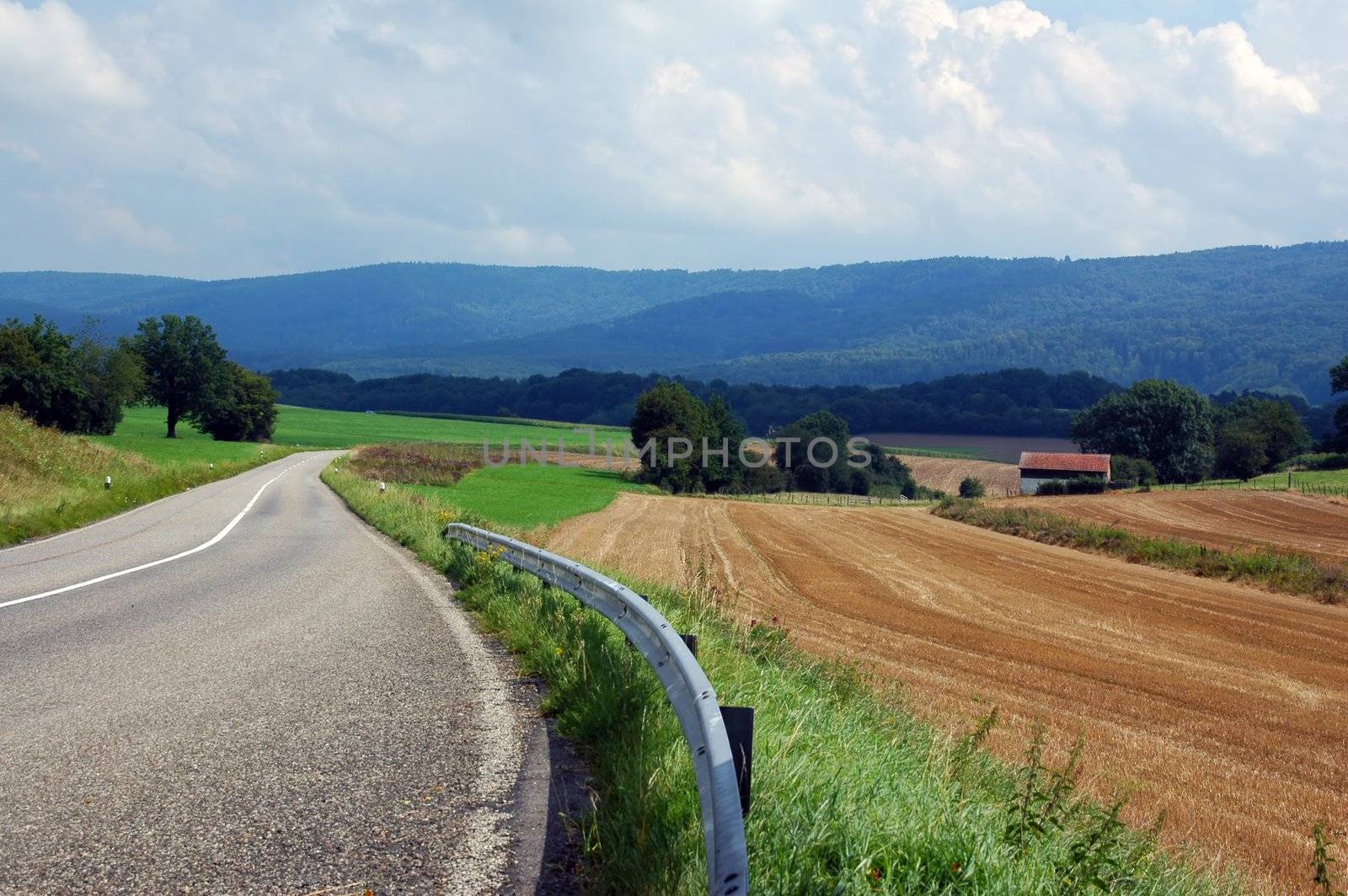asphalt road in landscapes of porrentruy, switzerland by raalves