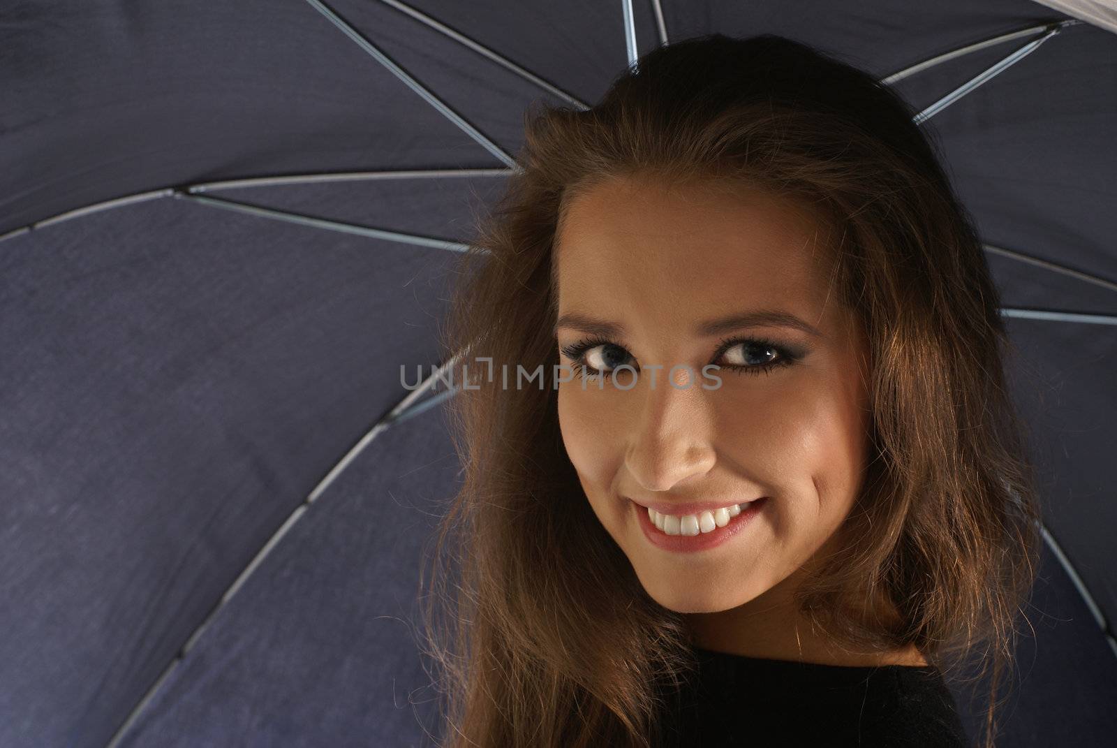 Young lovely georgian woman with umbrella isolated on white              