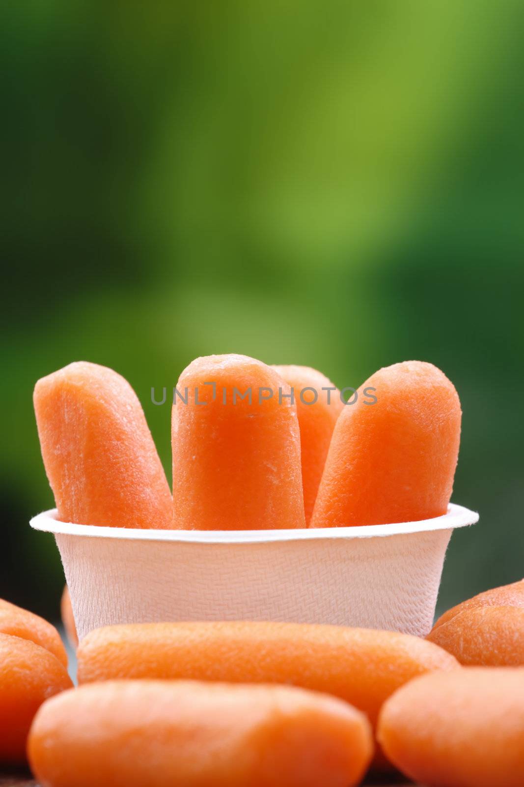 Organic peeled carrots in a recyclable bowl.