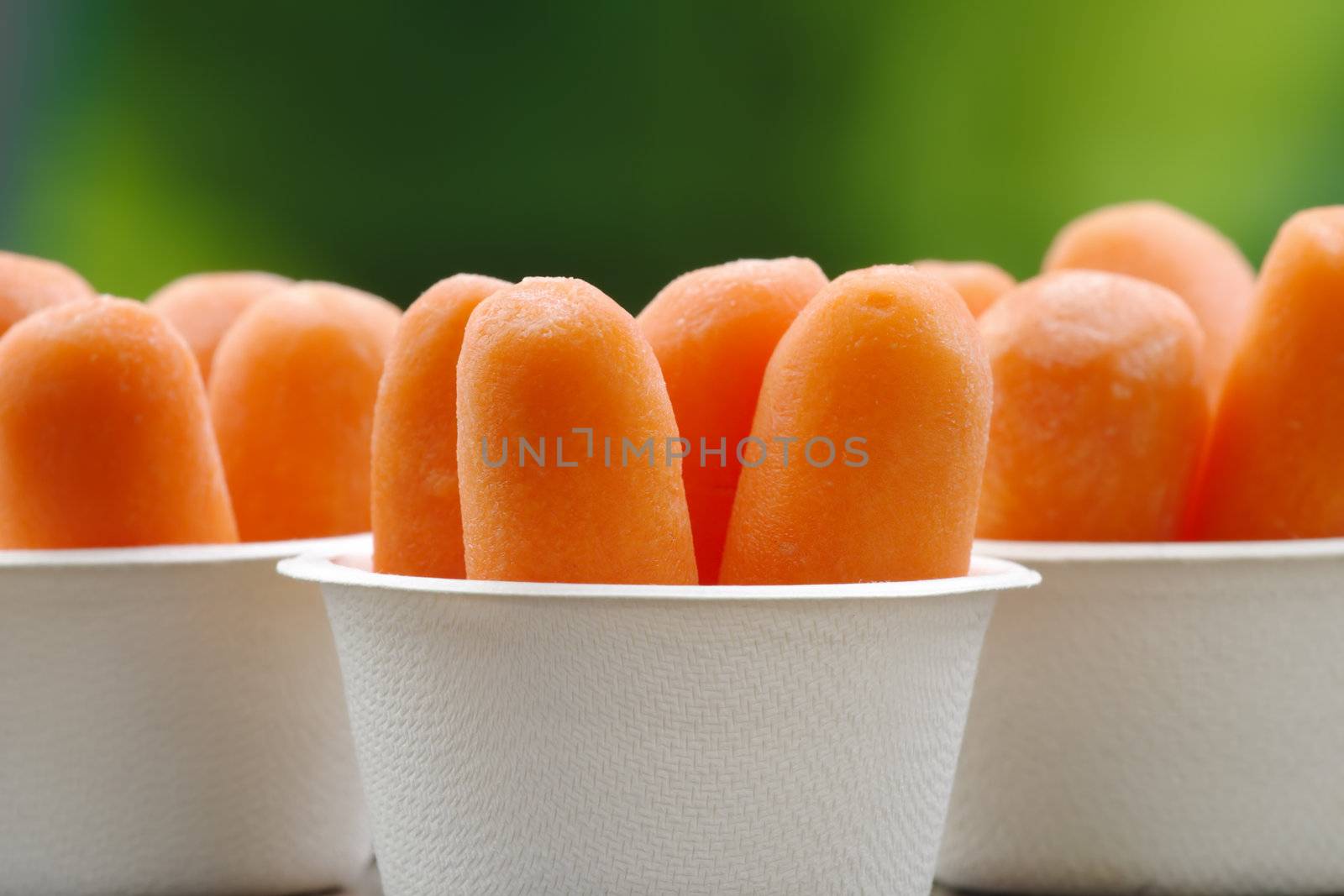 Organic peeled carrots in a recyclable bowls.